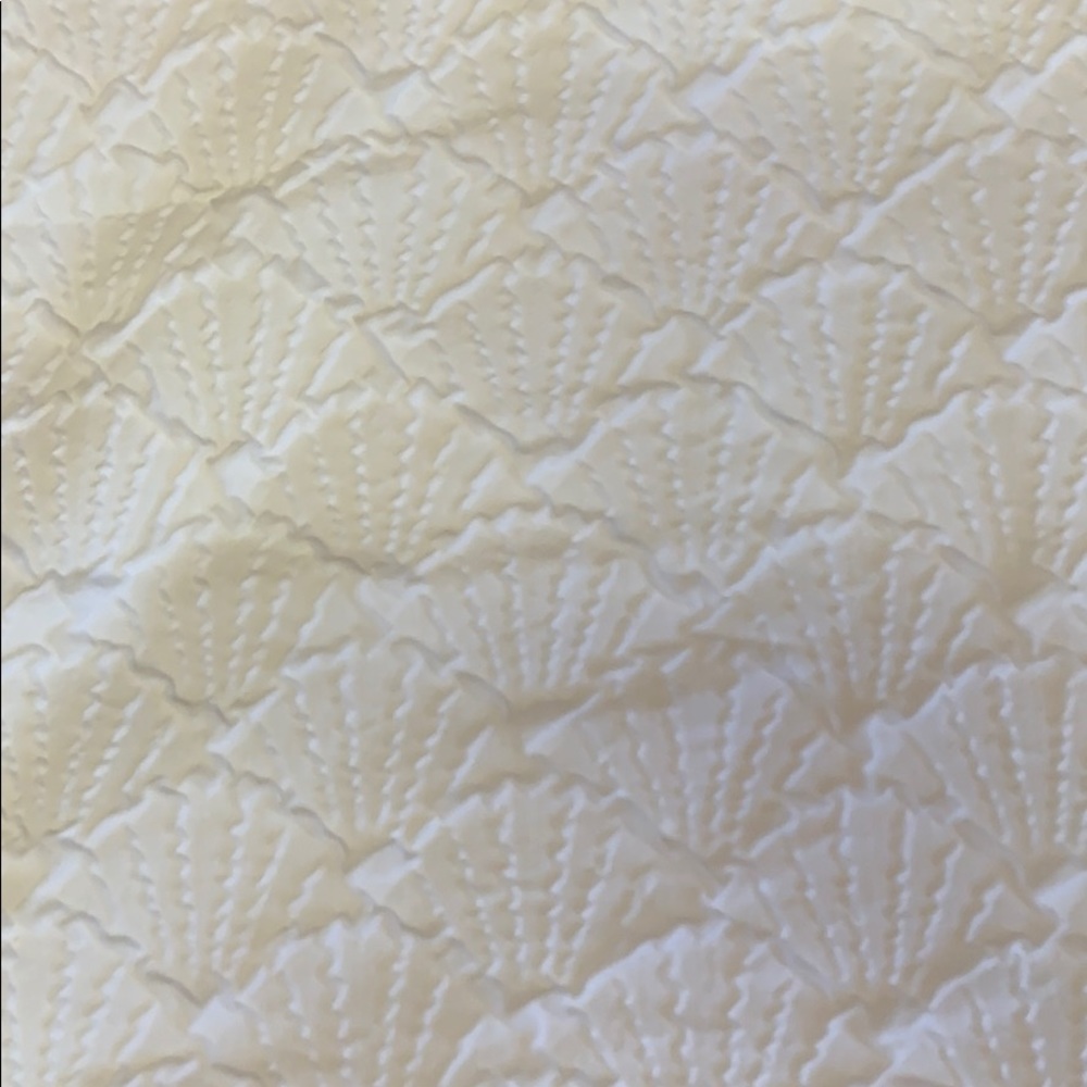 White seashell fabric shower curtain.